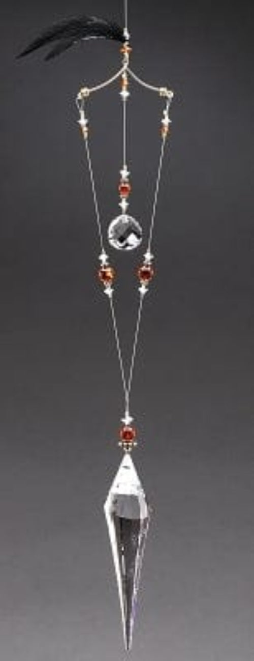 Decorative hanging crystal with beads on a dark background