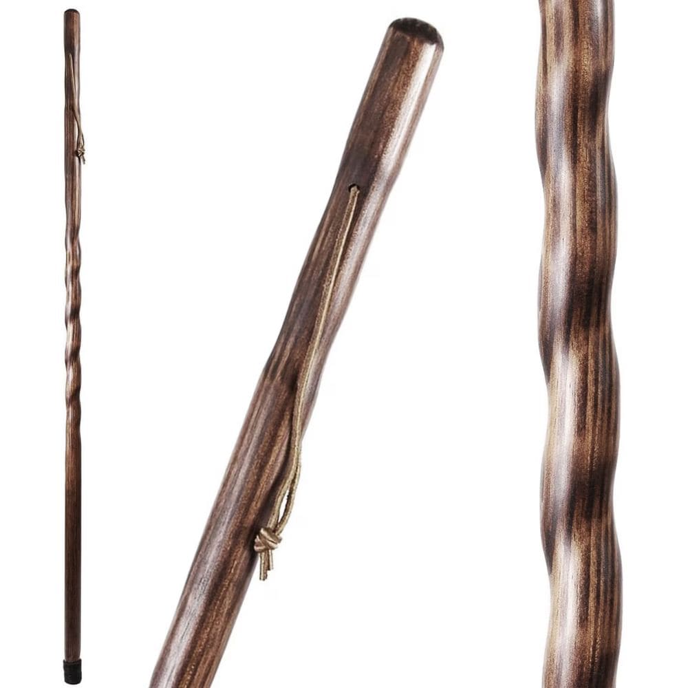 Three wooden walking sticks with different designs on a white background