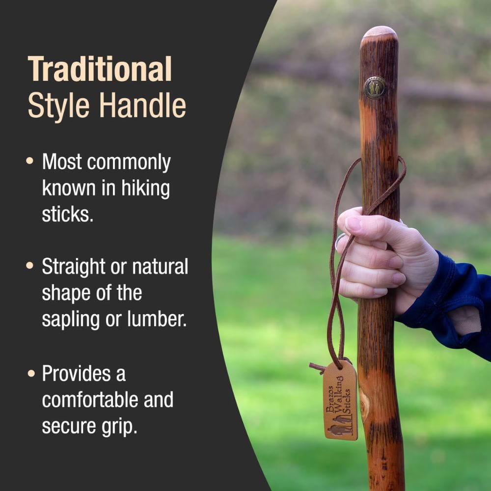Hand holding a wooden hiking stick with text about traditional style handles.