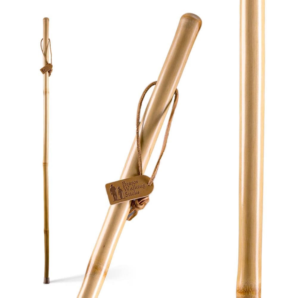 Wooden walking stick with leather strap and brand logo on a white background