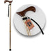 Wooden walking cane with a decorative handle on a white background