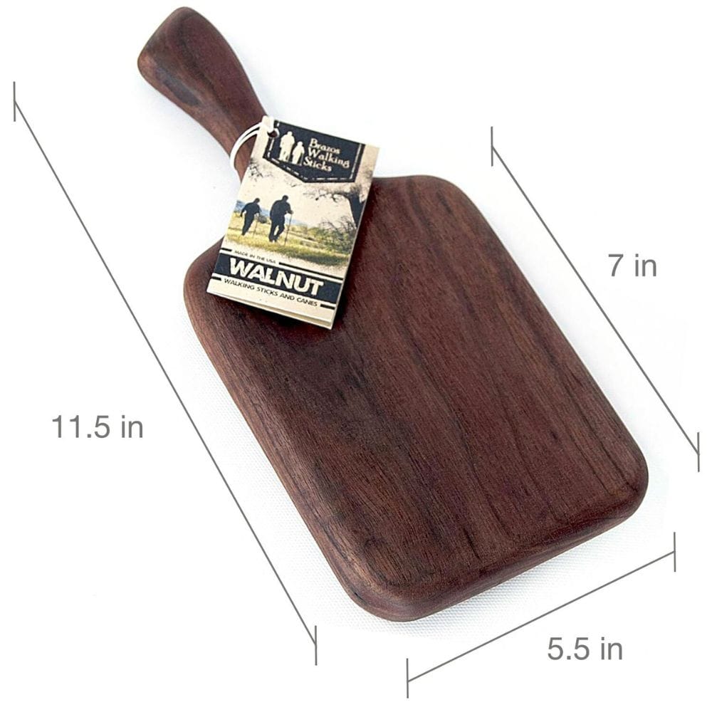 Wooden cutting board with handle and dimensions labeled, featuring a brand tag.