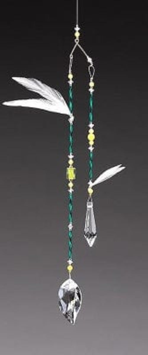 Decorative hanging ornament with crystals and beads on a gray background