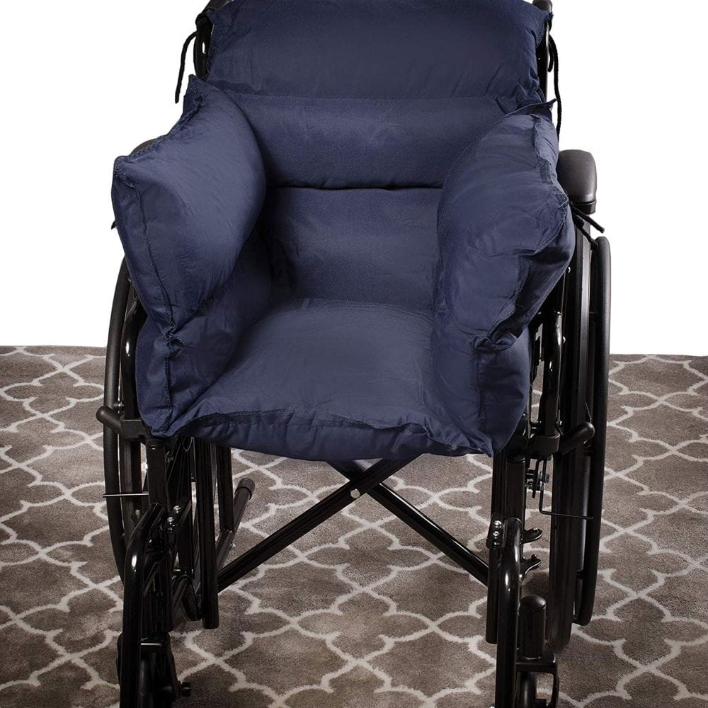 Wheelchair with large blue cushions on a patterned carpet