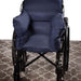 Wheelchair with large blue cushions on a patterned carpet