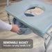 Bath chair with a removable bucket on a wooden floor