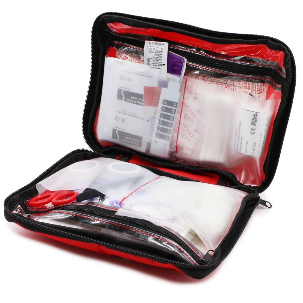 Open first aid kit with various supplies on a white background