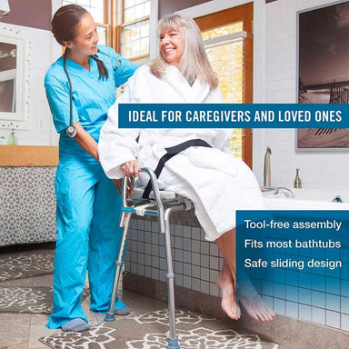 Caregiver assisting a person in a bathrobe with a tool-free assembly bathtub transfer aid.