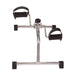 Metal exercise device with black foot pedals on a white background