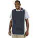 Man wearing a navy floral apron over a white shirt on a white background