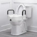 White toilet with a raised seat and handles in a bathroom setting