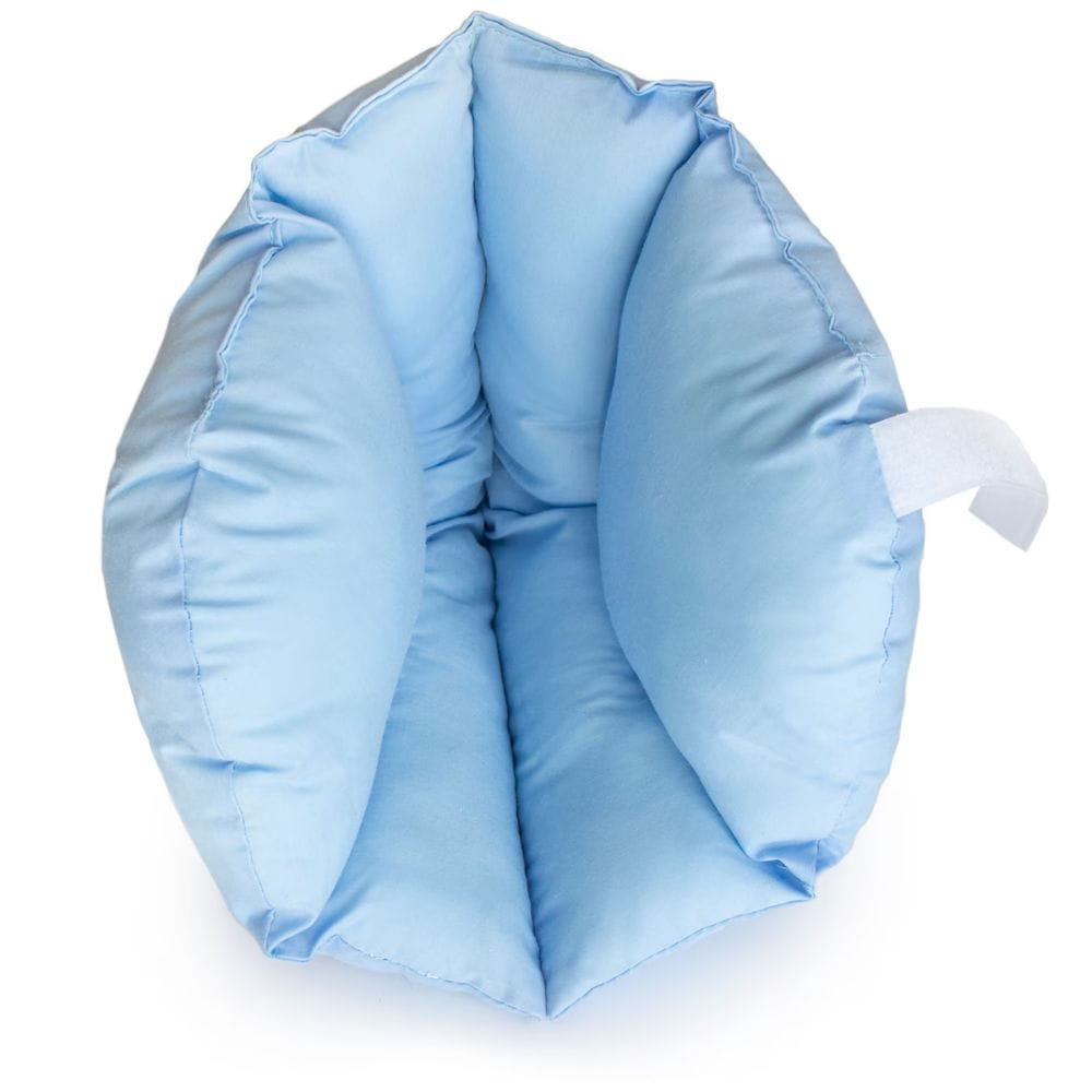 A light blue padded pet sling or cushion with a white strap detail, photographed on a clean white background.