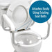 Toilet seat with a raised seat cover attached, showing how it can be easily installed using existing seat bolts.