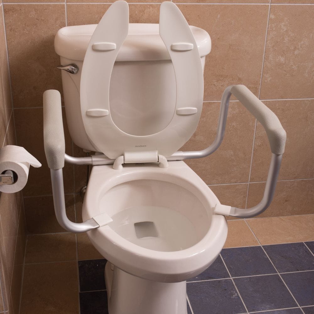 Toilet with a raised seat and grab bars in a bathroom setting.