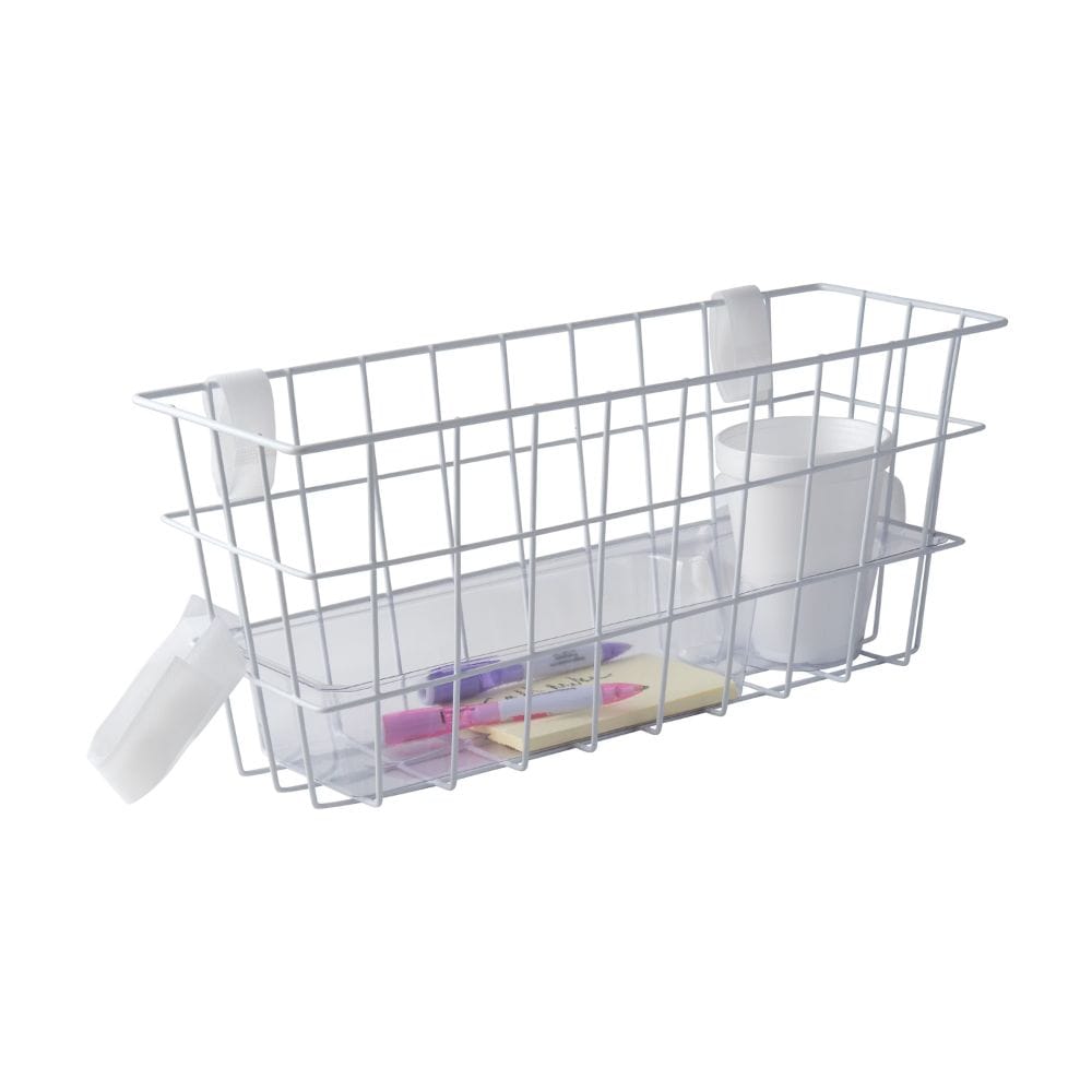 White wire storage basket with stationery items on a white background