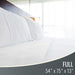 White bedding set on a bed with dimensions displayed