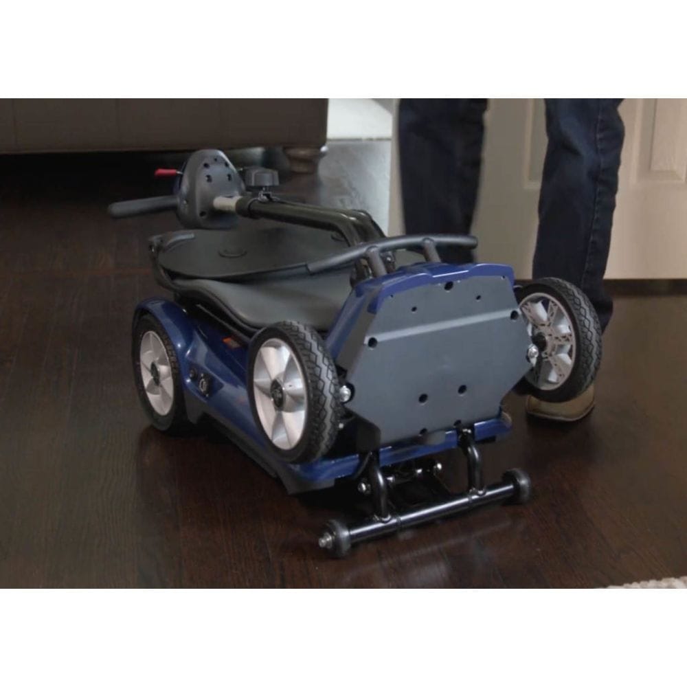 Blue mobility scooter on a wooden floor with a person partially visible.