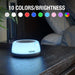 Habitat smart light bulb on a table with color options displayed above.