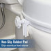 A white non-slip rubber pad clip mounted on the exterior of a white toilet bowl, with a text overlay at the bottom reading 'Non-Slip Rubber Pad' and 'Grips securely on bowl exterior'.