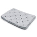 Gray cushion with multiple holes on a white background