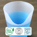 Silicone cup with blue liquid and safety certification labels on a wooden surface