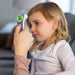 Child having their temperature taken with a digital thermometer.