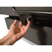 Hand opening a car door panel with a lock mechanism