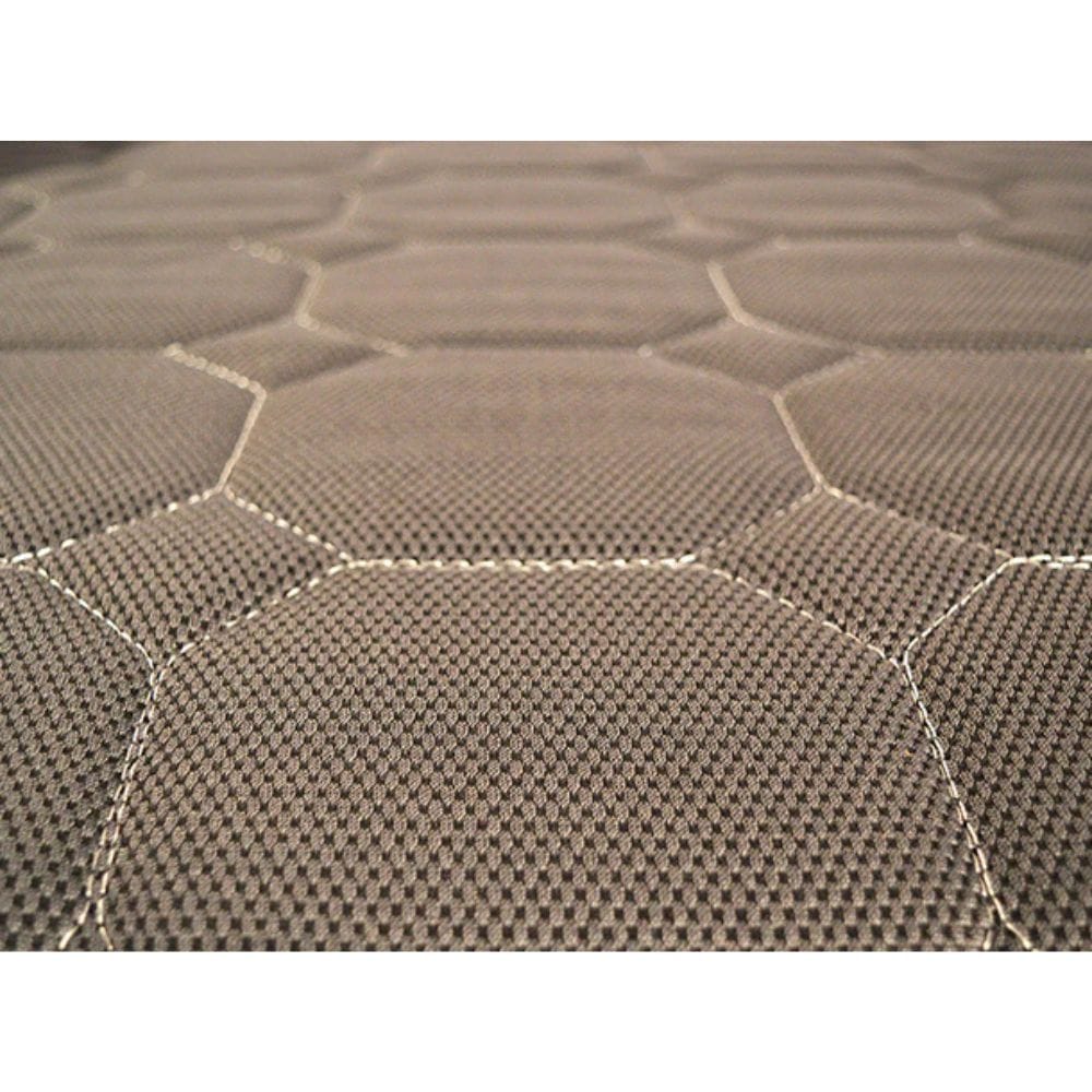 Close-up of a textured brown rug with geometric pattern