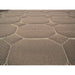 Close-up of a textured brown rug with geometric pattern