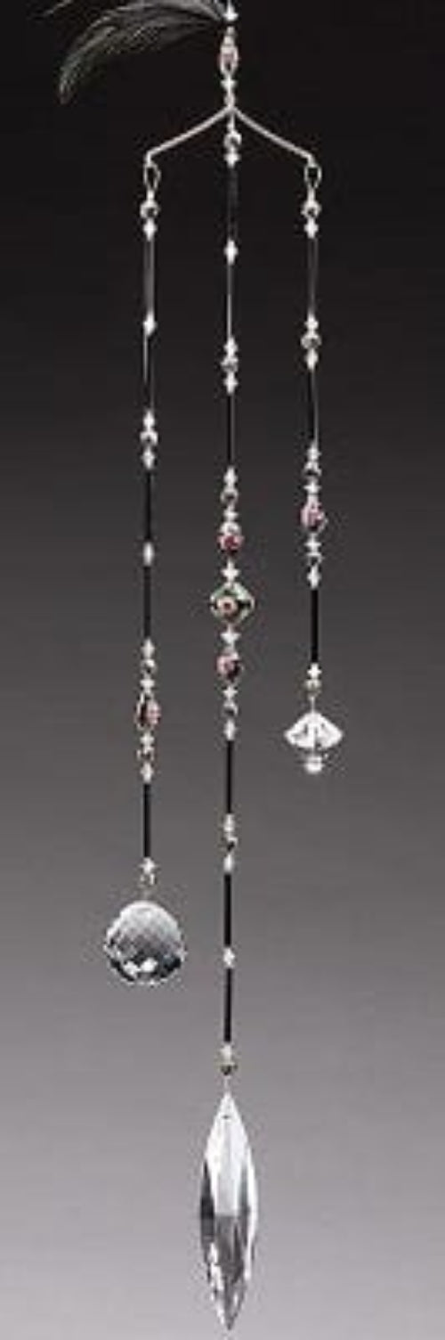 Decorative hanging crystal with beads on a gray background