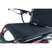 Black motorcycle seat with a textured pattern on a white background