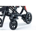 Close-up of a wheelchair with black wheels on a white background