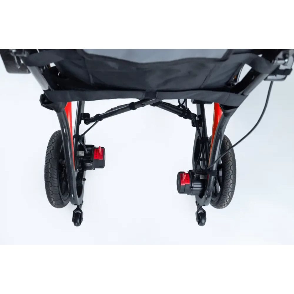 Close-up of a stroller's wheels and suspension mechanism on a white background