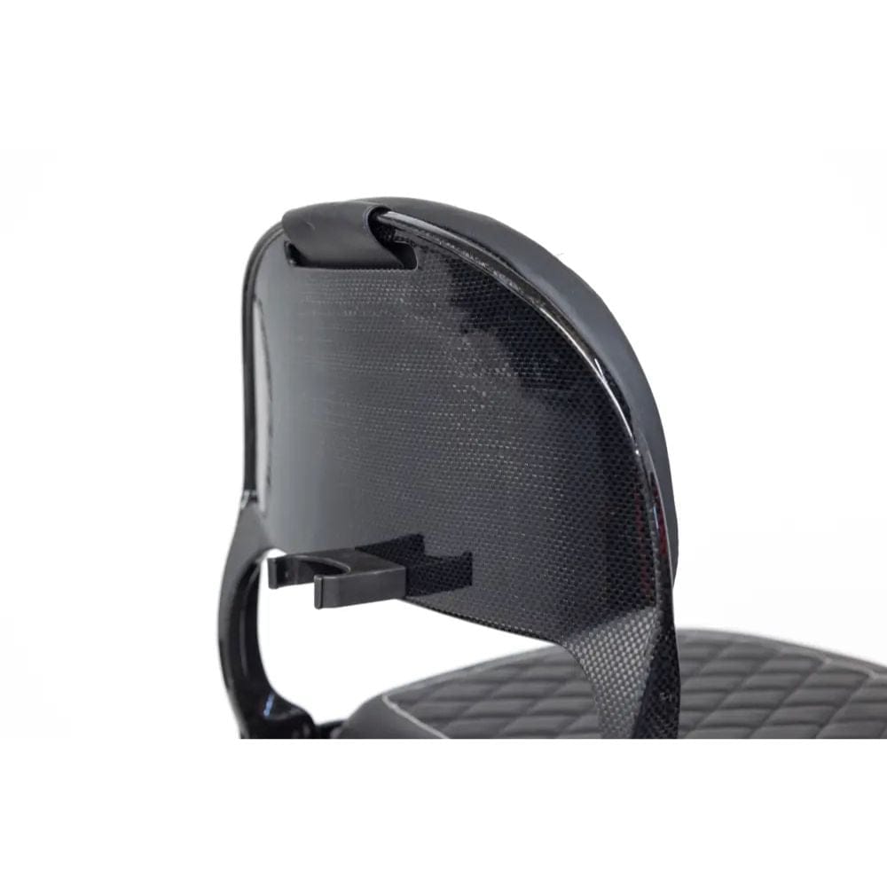 Black motorcycle seat with a textured surface on a white background