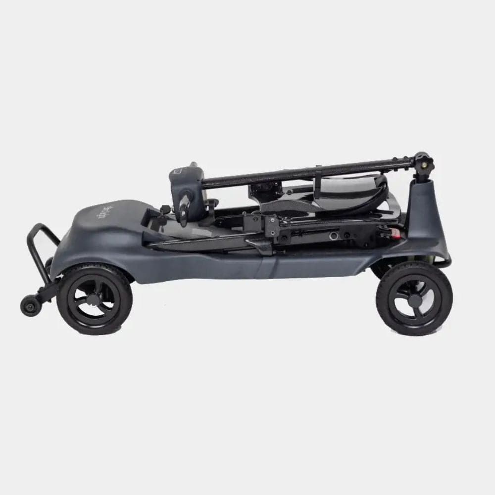 Black metal object with wheels on a white background