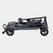 Black metal object with wheels on a white background