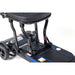 Close-up of a black scooter with visible mechanical components on a white background