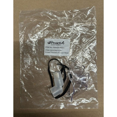 Pediatric Aerosol Mask in clear plastic packaging on a brown background