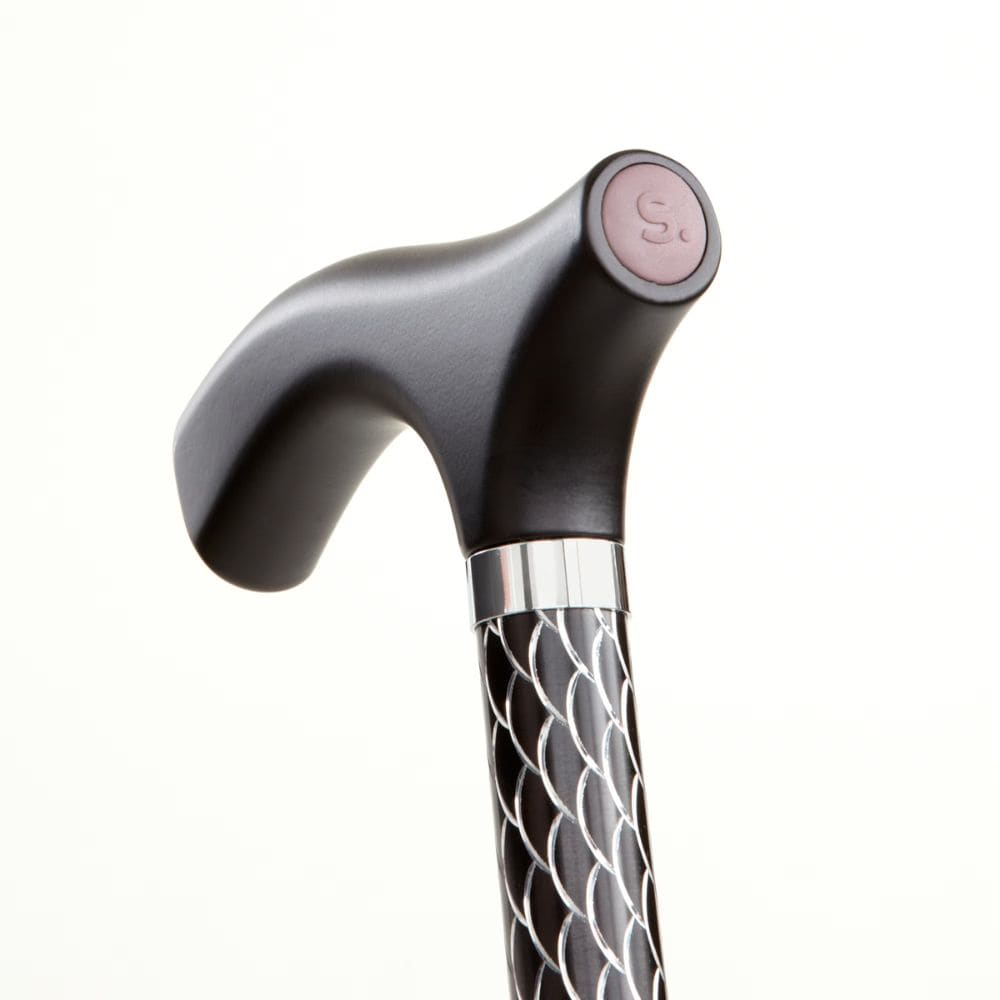 Silver and black walking cane with decorative handle on a white background