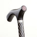 Silver and black walking cane with decorative handle on a white background