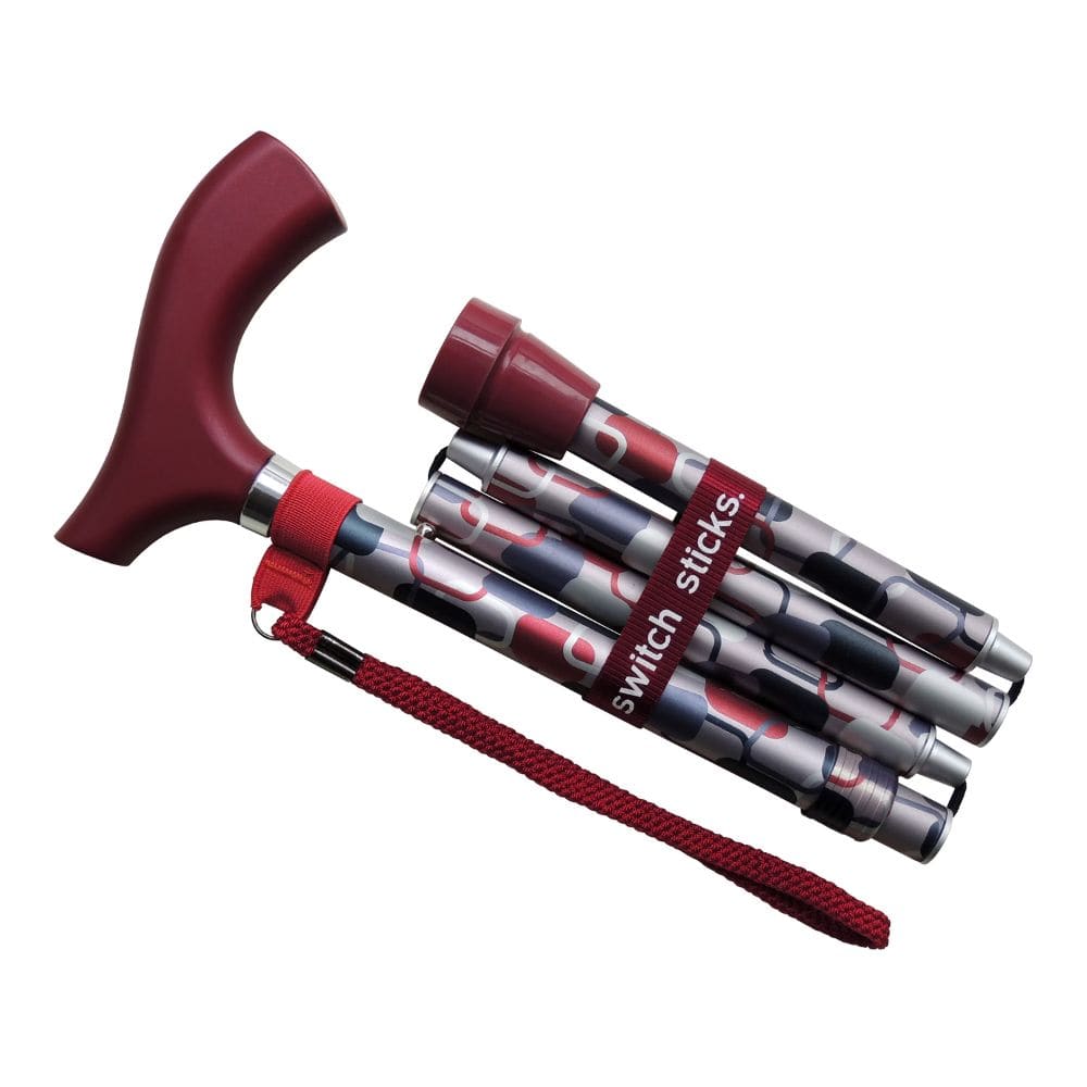 Collapsible walking stick with red handle and grip on a white background