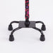 Black tripod stand with a colorful handle on a white background