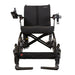 Black wheelchair with armrests and footrests on a white background