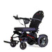 Black electric wheelchair with 'Travel Buddy' branding on a white background