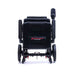 Black electric wheelchair with 'Travel Buggy' logo on a white background