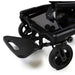 Close-up of a black stroller with safety lock mechanism on a white background