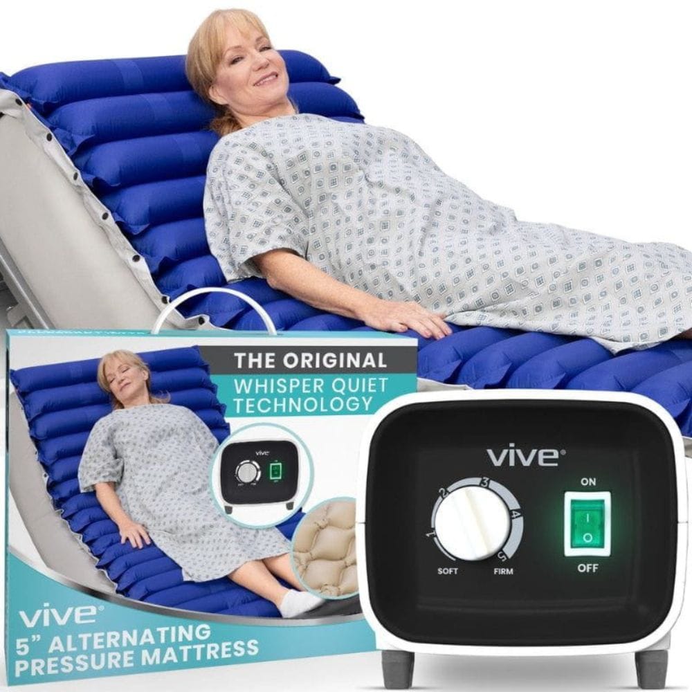 Woman lying on an alternating pressure mattress with Vive branding and control panel.