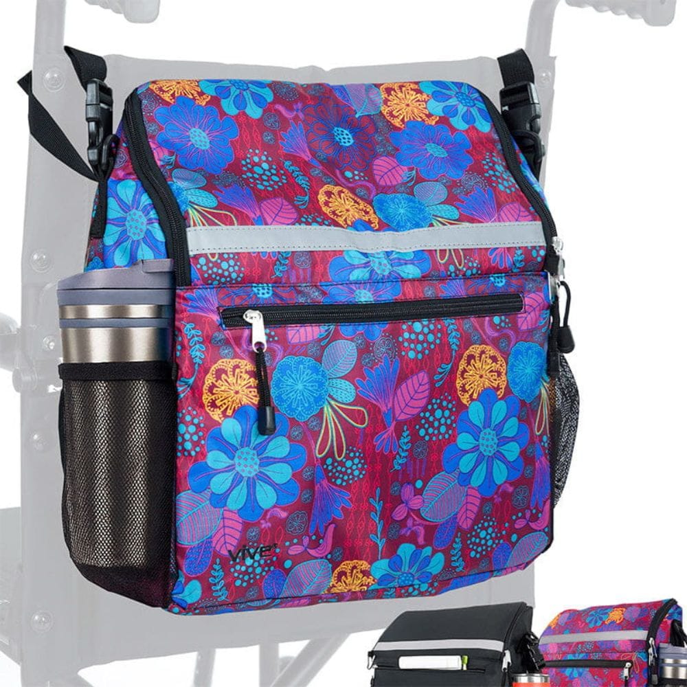 Colorful floral-patterned bag attached to a stroller with a tumbler inside.