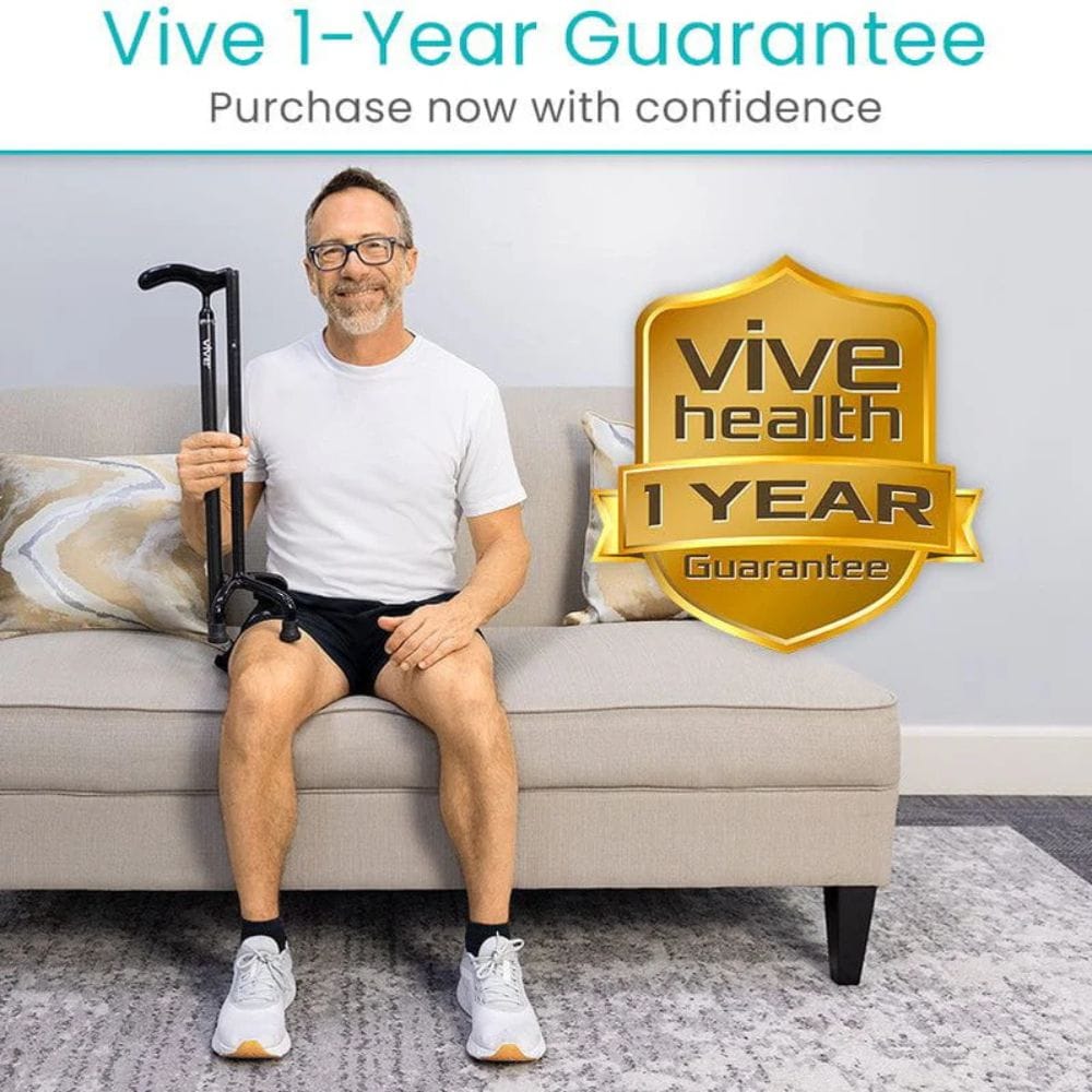 Man sitting on a couch holding a walking stick with 'Vive Health' 1-year guarantee badge.