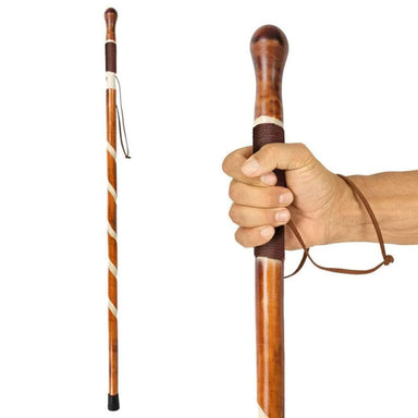 Wooden walking stick with a hand holding it on a white background